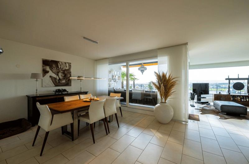 Dining room with large windows overlooking a scenic view