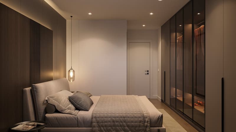 Spacious bedroom with a large bed, dark wood wardrobe, and pendant lighting. The room has a minimalist and modern design with neutral colors and clean lines.