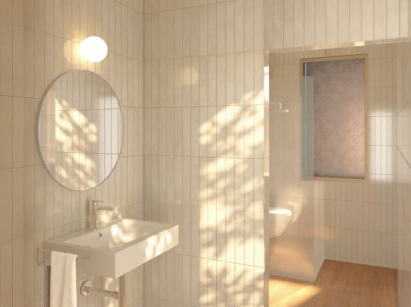Bathroom with white tiles, round mirror, white sink, white towel, white toilet, glass window, wooden floor
