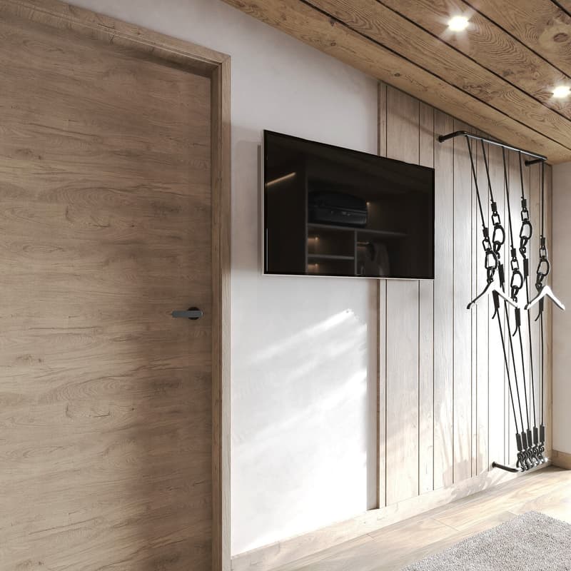 wooden door, mounted flat screen TV, wooden wall, coat hangers