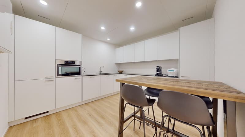 modern kitchen with white cabinets, wooden countertop, stainless steel appliances, dishwasher, washing machine