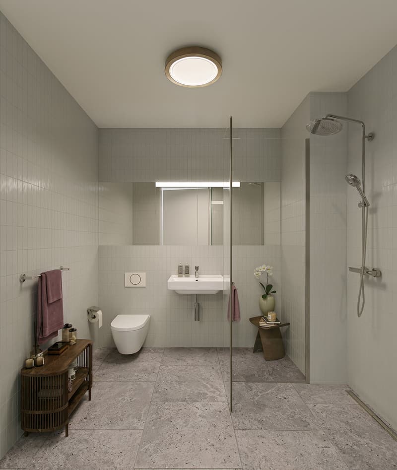 modern bathroom with a shower, a toilet, a sink, a mirror, and a wooden side table with flowers.