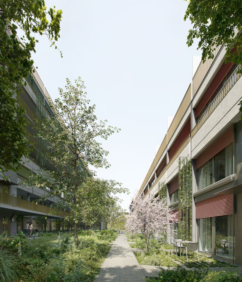 The exterior view of a multi-storey residential building with balconies and greenery.
