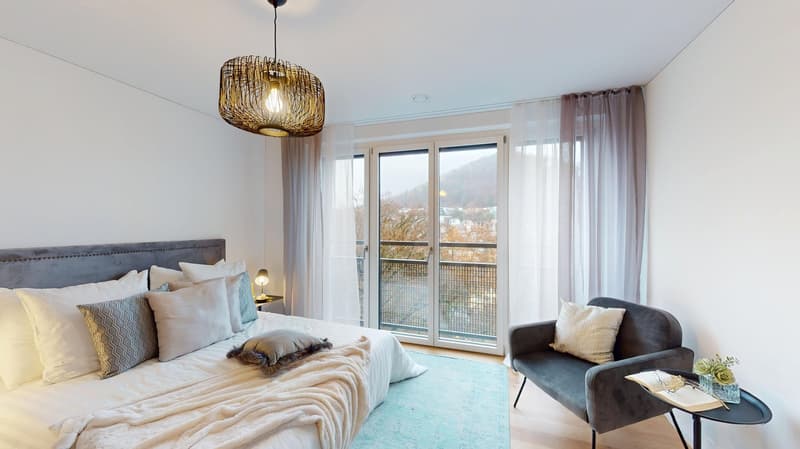large bed, pillows, blanket, rug, chair, table, lamp, pendant light, sliding glass doors, balcony, view