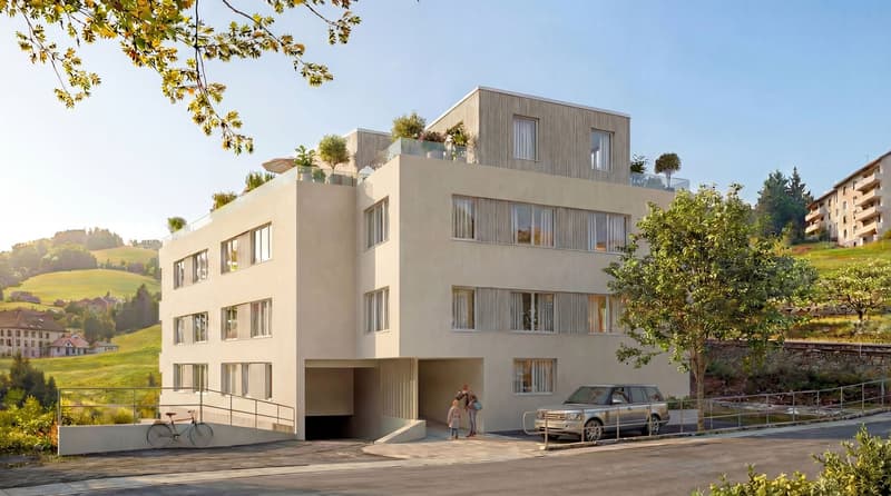 4 story building, beige exterior, multiple windows, garage, balcony on top floor