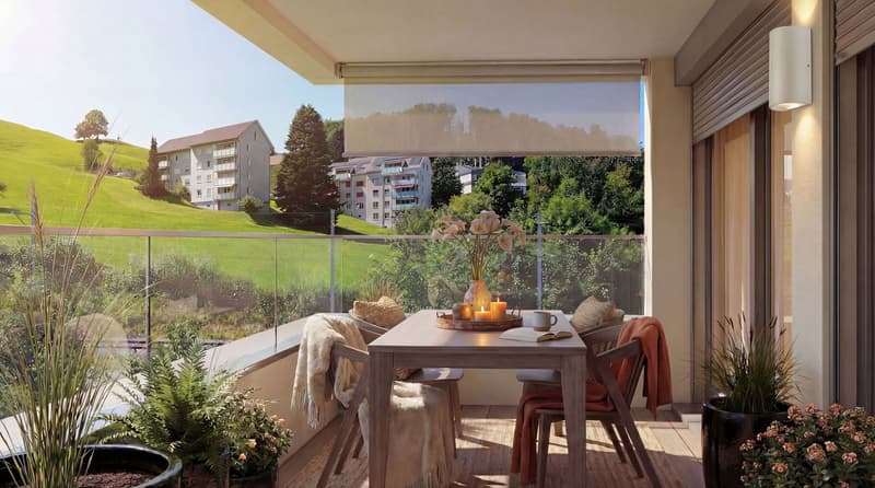 Balcony with table and chairs, glass railing, plants, view of the hills