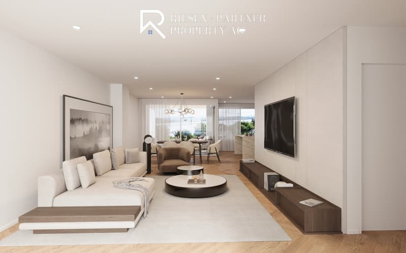 Large couch, two round tables, large screen TV, dining area visible through doorway