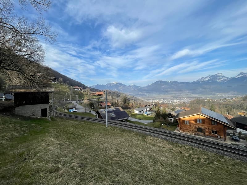 Mountains, wooden houses, train tracks, clear sky, solar panels
