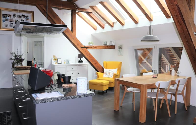 kitchen with dining area, wooden beams, wooden table, yellow chair, white chairs, wooden floor