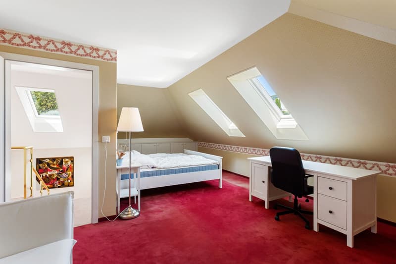 bedroom with bed, desk, chair, lamp, carpet, window, painting