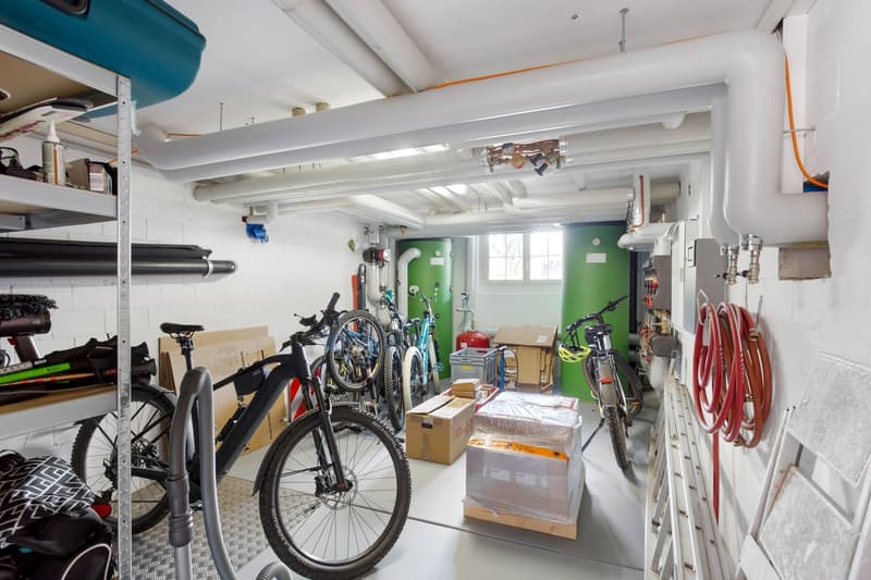 Storage room with bicycles, boxes, and various equipment