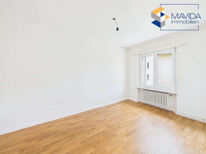 empty room, white walls, wooden floor, white radiator, window