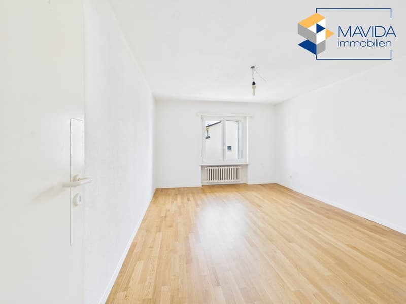 empty room, wooden floor, white walls, window with white frame, white radiator