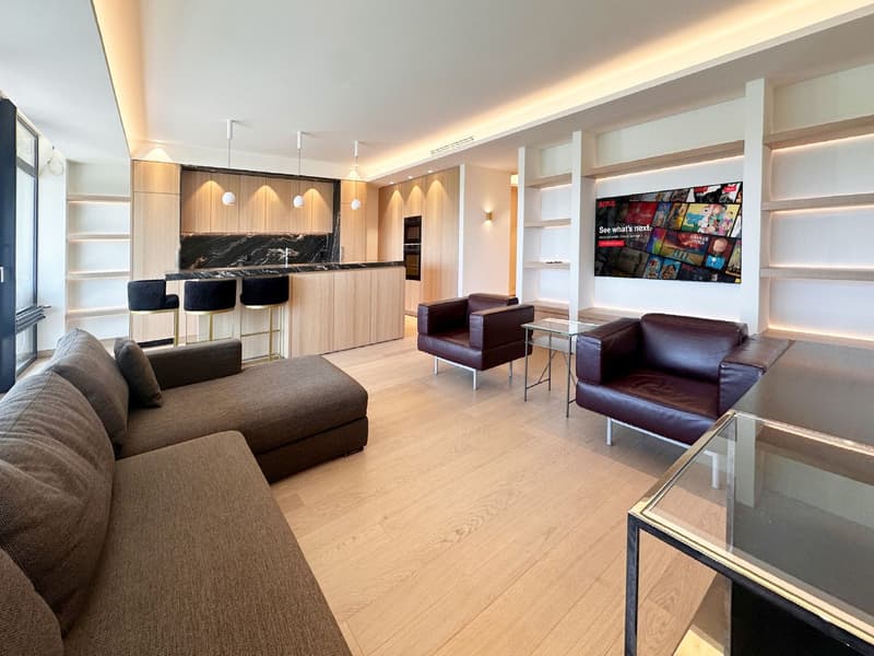 modern living room, large sofa, two armchairs, coffee table, TV, wooden floor, open kitchen, bar stools, shelves, kitchen island, marble countertop, modern appliances