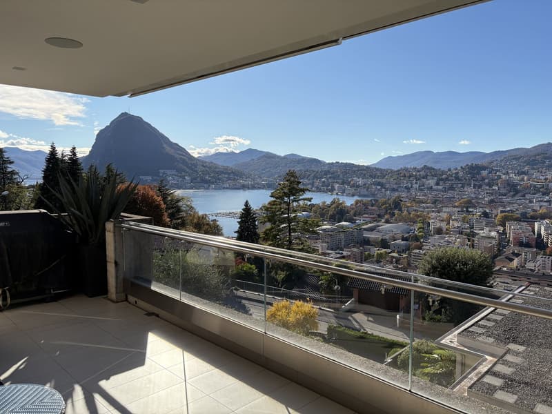 Glass railings, tiled floor, glass walls, plants