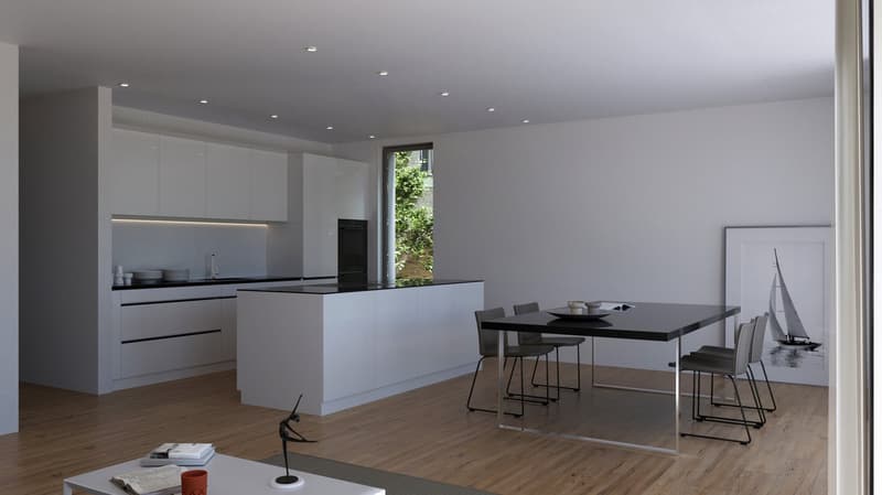 Spacious open-plan kitchen and dining area with modern, minimalist design. The kitchen features white cabinets, black countertops, and built-in appliances including a dishwasher. The dining area has a large black table with chairs. The room has hardwood f