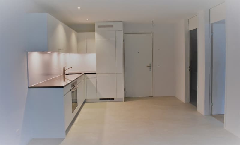 kitchen with white cabinets, marble countertop, gas stove, sink, faucet, tiled floor