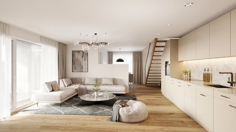 Living room with beige sofa, coffee table, carpet, lamp, and wooden floor. The space includes a staircase, kitchen area, and a white wall.