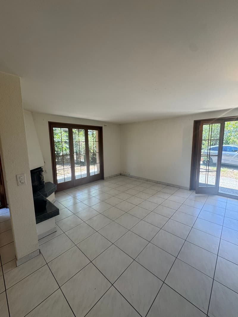 tiled floor, white walls, sliding glass doors, fireplace, balcony