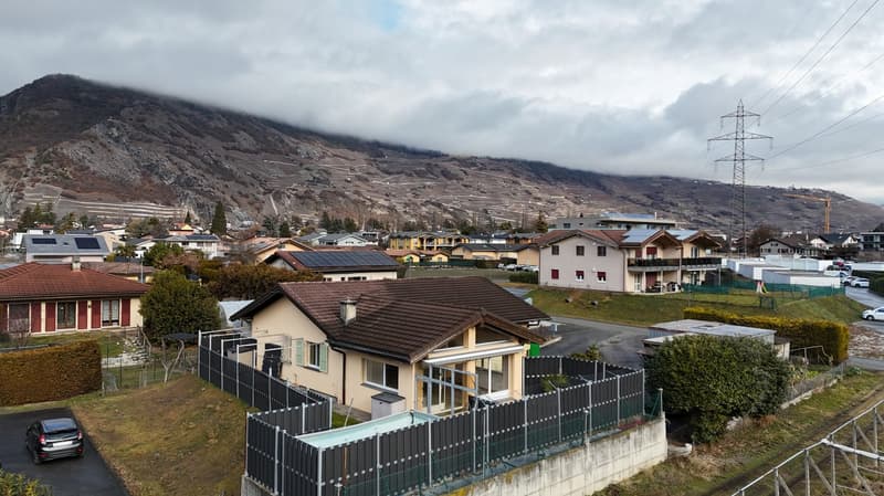 single-family house, brown roof, solar panels, swimming pool, mountain view