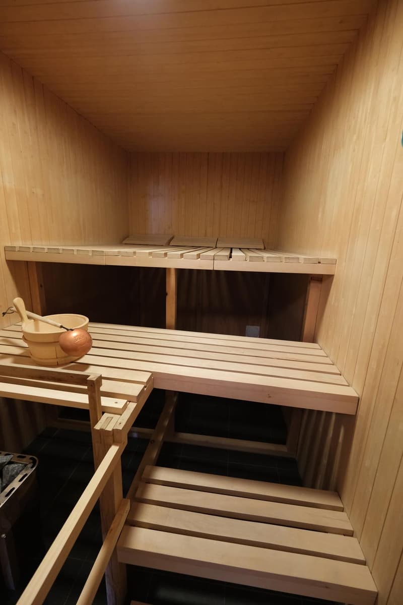 wooden interior, wooden benches, small wooden box for buckets