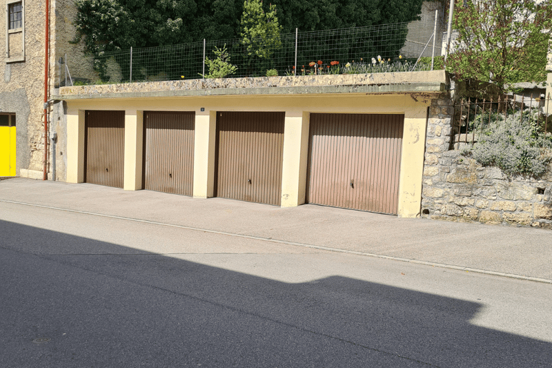 building exterior with a row of four garages