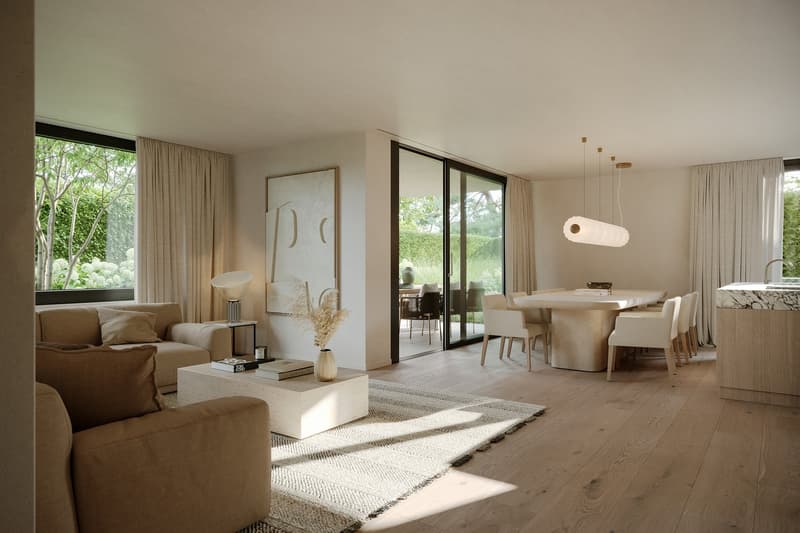 Open-concept living and dining area with large windows overlooking a garden, hardwood floors, neutral-toned furniture and decor, and a modern lighting fixture above the dining table