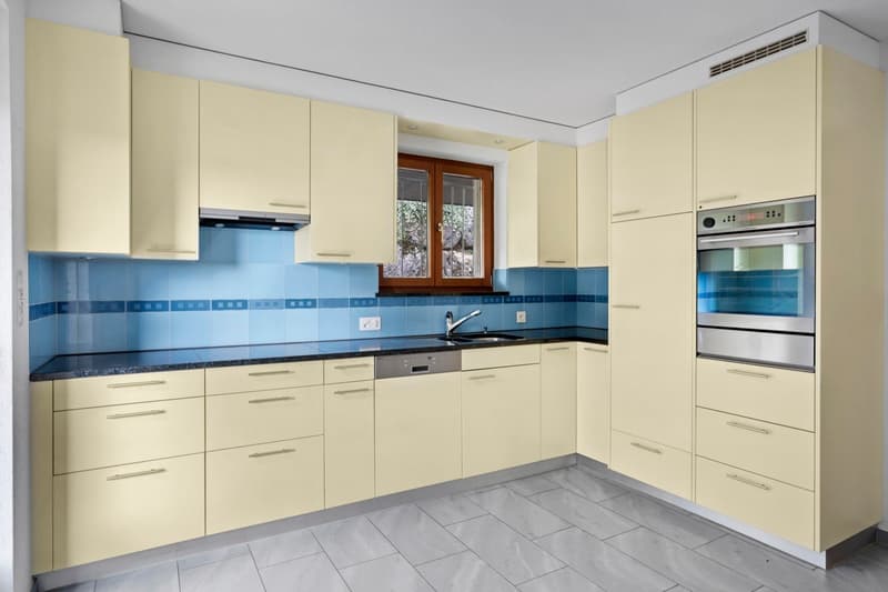 modern kitchen, cream cabinets, blue tiles, gas oven, dishwasher, faucet, sink