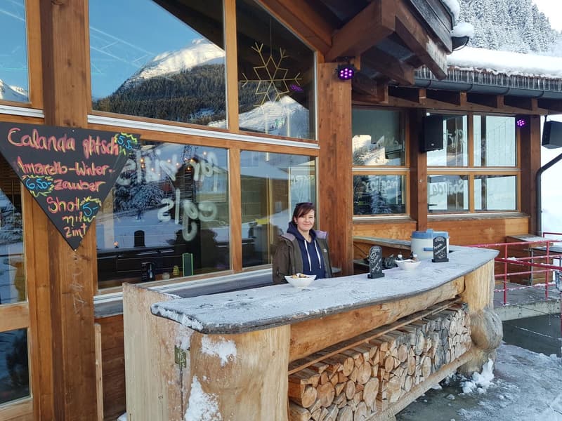 Wooden building, outdoor bar counter, snow around