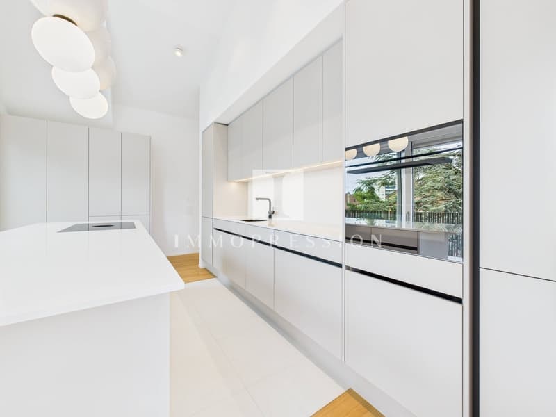 modern kitchen, white cabinets, white countertops, stainless steel sink, white tiled floor, large window with view