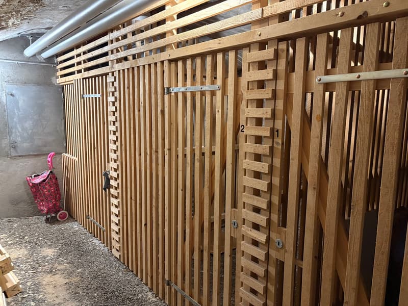 large wooden gates, small trolley, metal doors