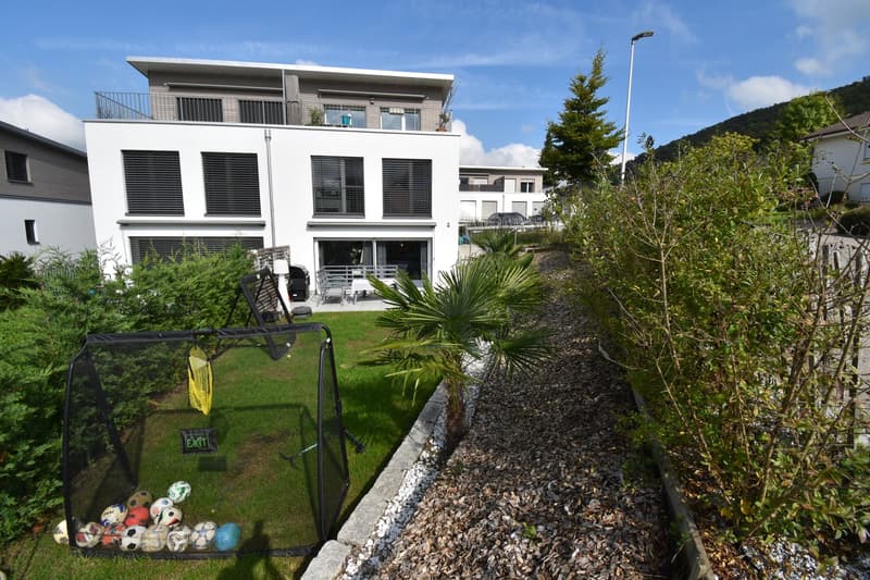 Modern white house, 3 stories, balcony, garden with soccer goal, palm tree, gravel path