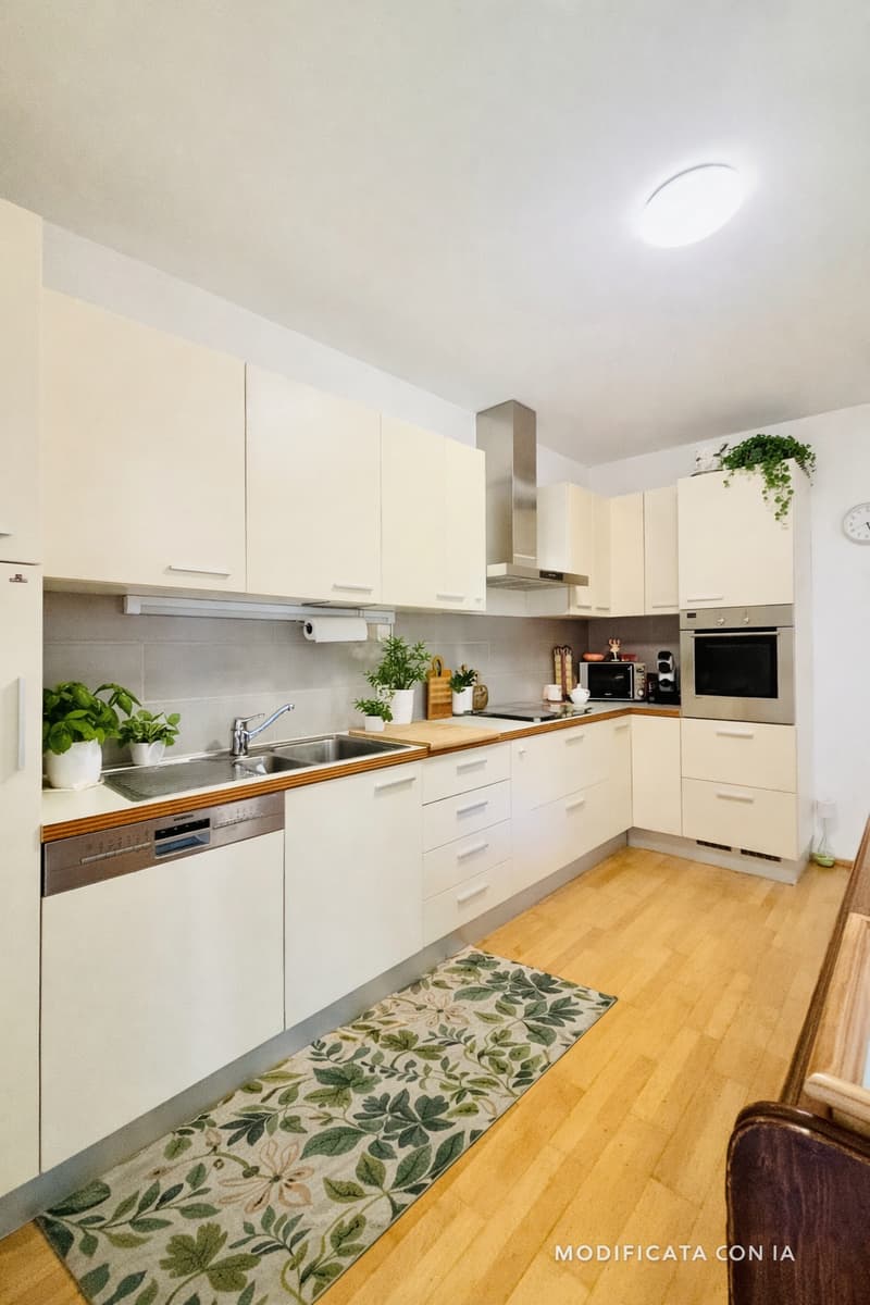 modern kitchen with white cabinets, wooden floor, stainless steel appliances, sink with faucet, dishwasher, countertop with plants and kitchen utensils