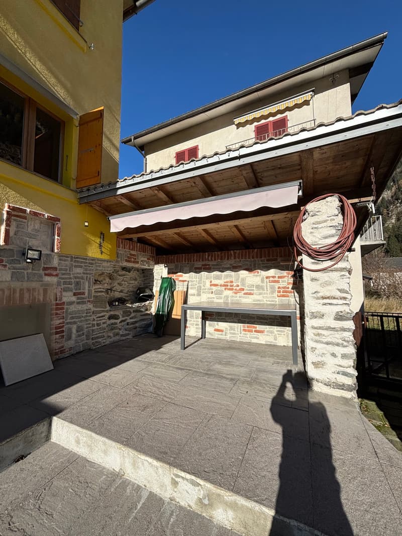 detached house, stone wall, brick wall, wooden awning, fireplace, covered patio
