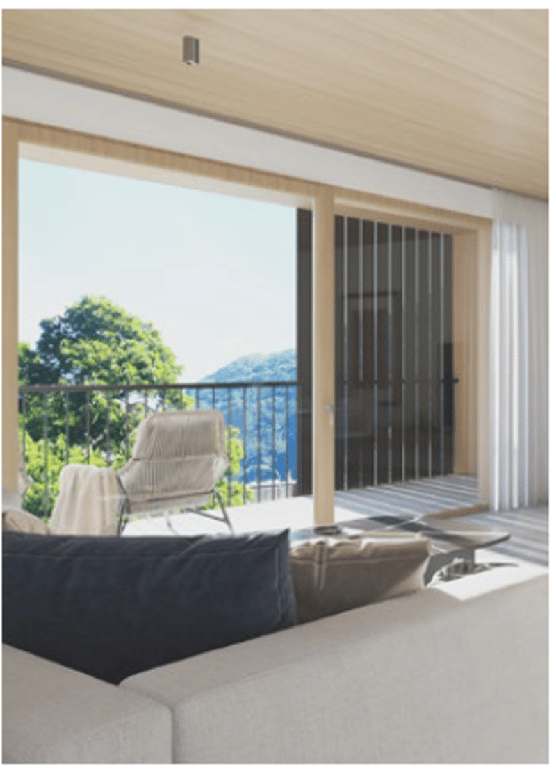 Glass doors, balcony with railing, cushioned chairs, large sofa, table, view