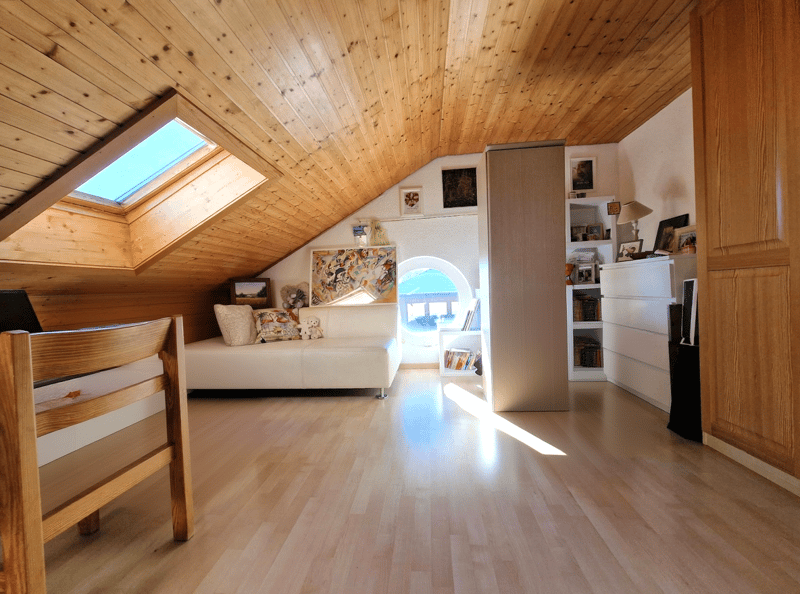 wooden ceiling, white sofa, wooden chair, white shelves, skylight