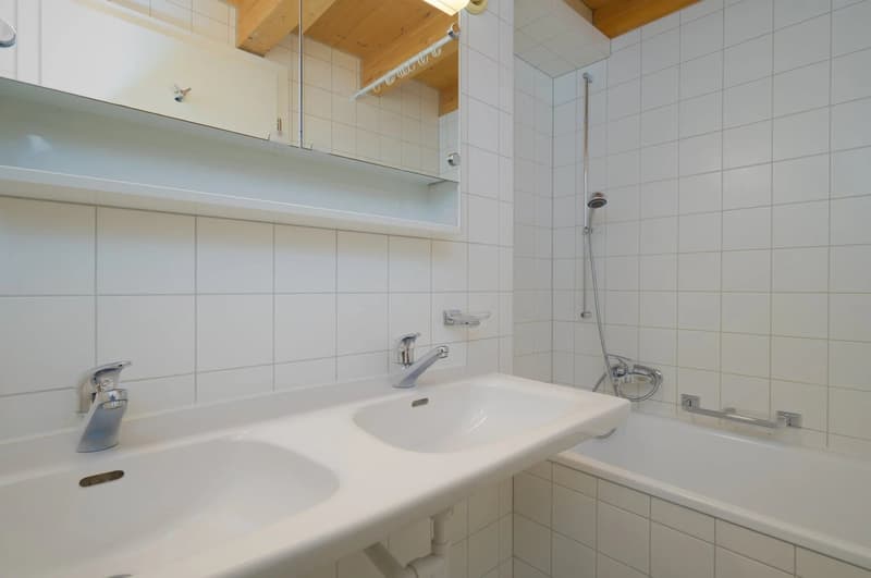 white tiled walls, double sink, bathtub, shower, mirror, wooden ceiling