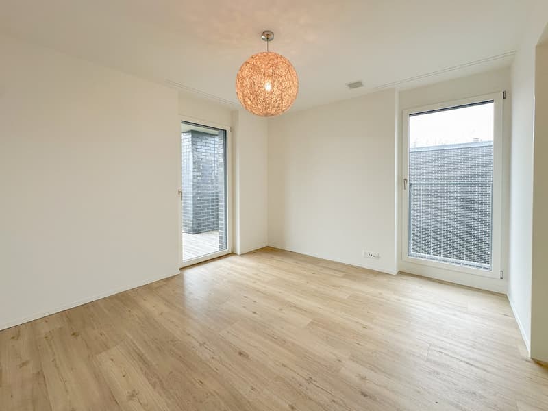 open floor plan, hardwood flooring, sliding glass doors, balcony, ceiling lamp