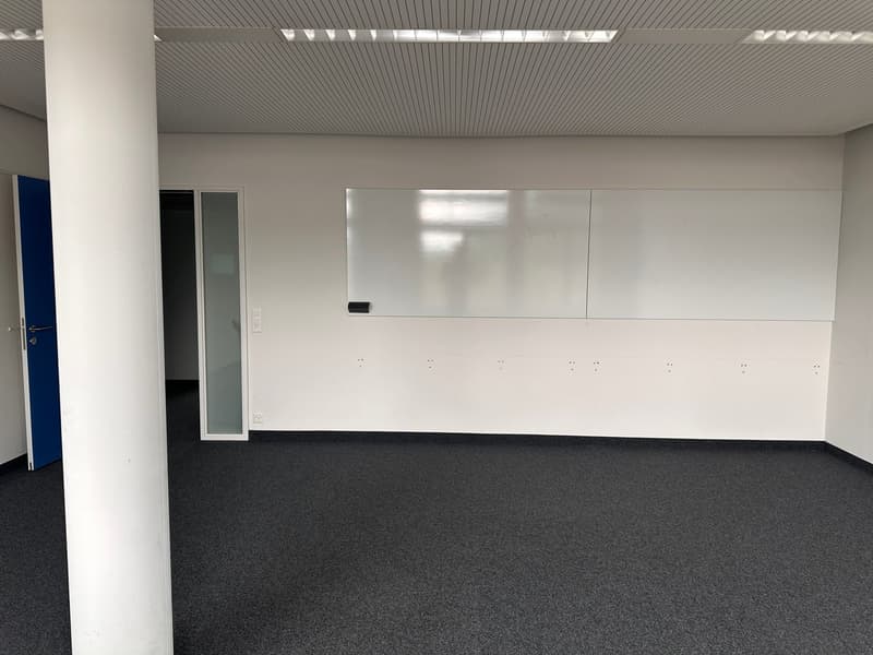 modern office room, empty, white walls, gray carpet, whiteboard, glass door, column