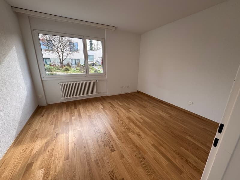 empty room, hardwood floor, large window, white wall, wall heater