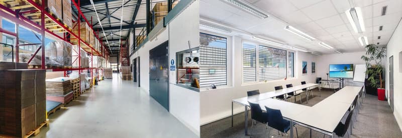 The image shows a large warehouse space with high ceilings, metal shelving units, and a loading dock area. There is also an office space visible, with a conference table, chairs, and a TV screen on the wall. The overall space appears to be a modern, well-