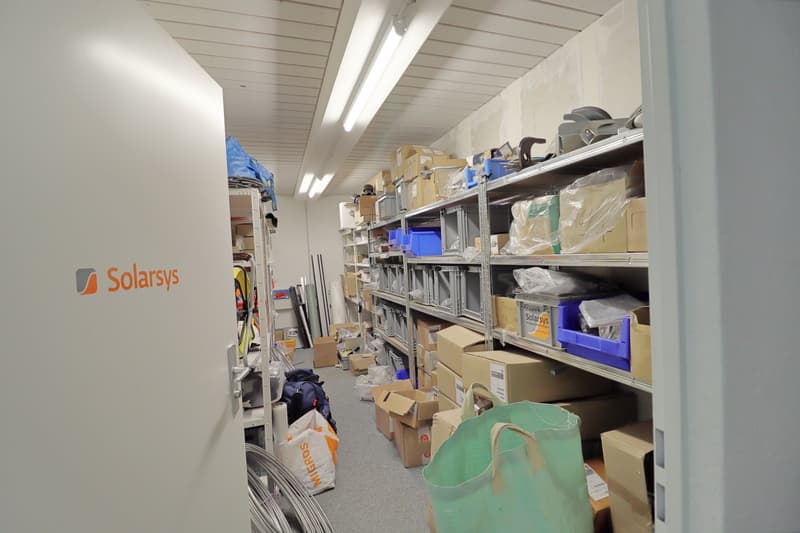 Storage room with shelves, boxes, bags, and various items