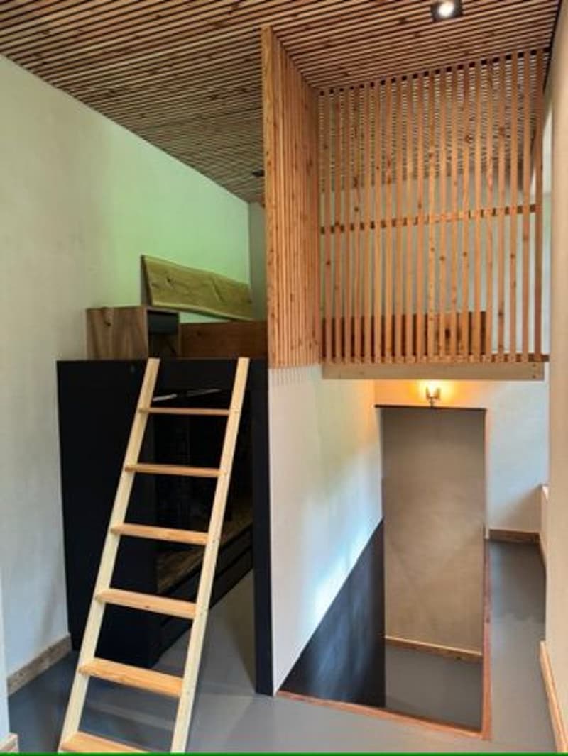 wooden ladder, wooden ceiling, wooden partition, wooden floor, black furniture