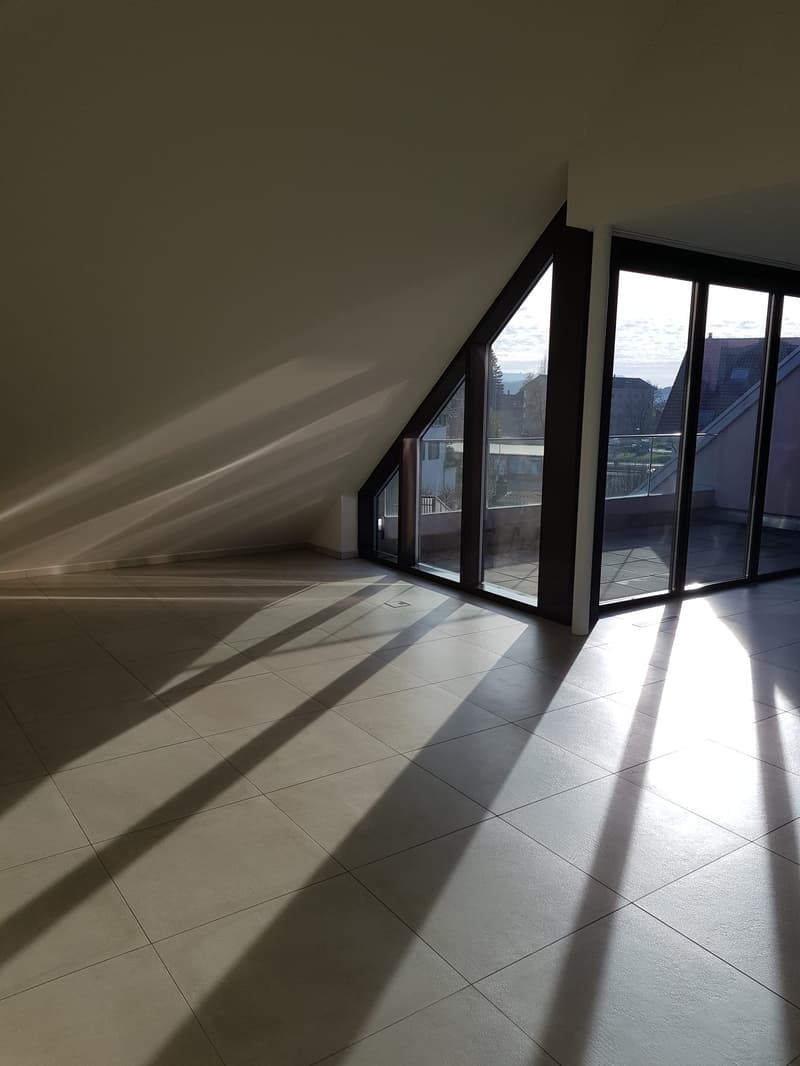 empty room, white tile floor, large windows, balcony