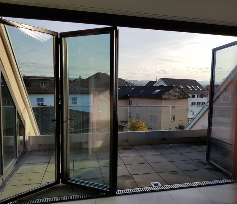 open sliding glass doors, balcony, tiled floor, view of the city