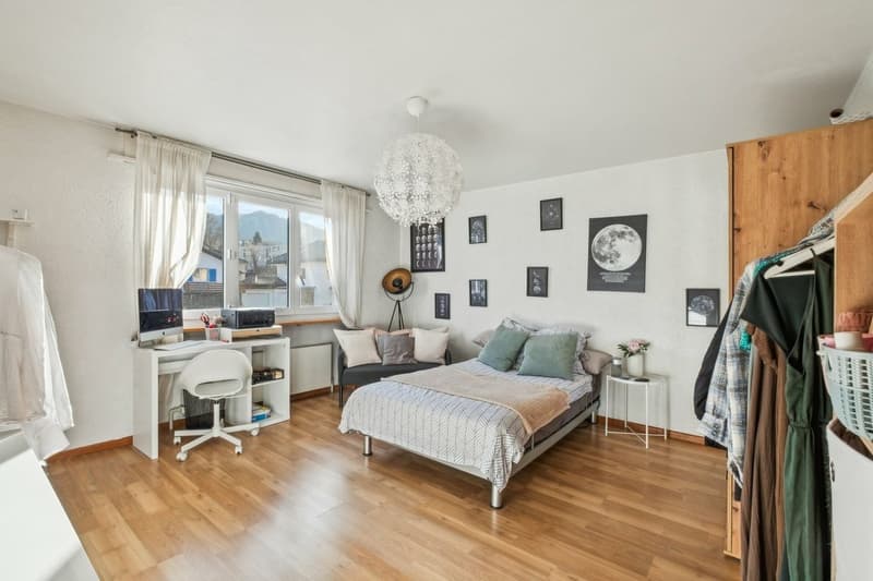 Immeuble avec 2 appartements, 1 salon de coiffure, un terrain à bâtir (7)