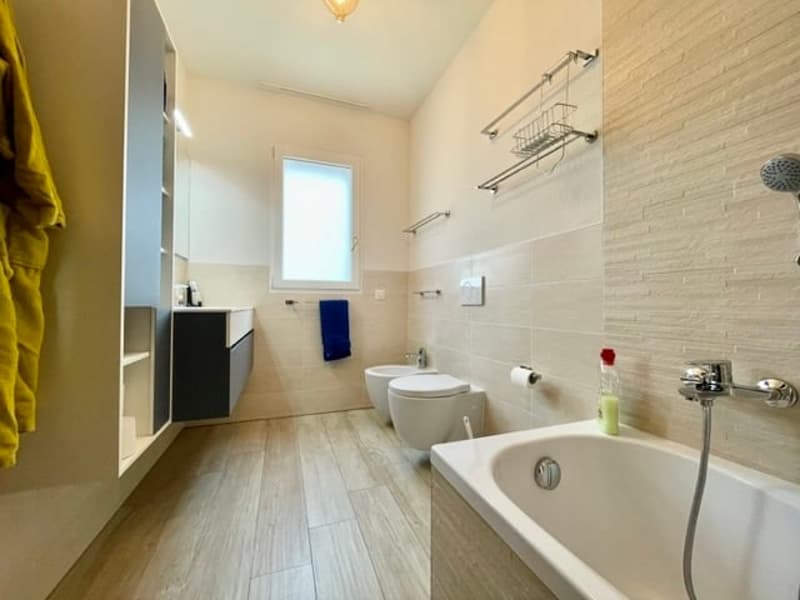 Moderno appartamento 3.5 a Lema Curio con giardino privato (5)