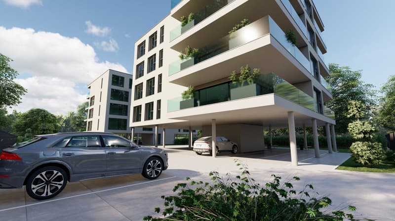 Modern multi-story apartment building with balconies, parking spaces, and landscaping in the foreground