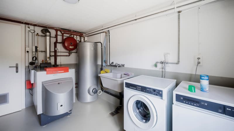 Laundry room with washing machine, dishwasher, water heater, and sink
