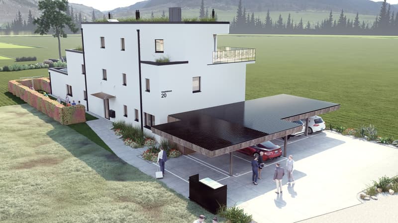 3-story apartment building with a modern, minimalist design. The building has a flat roof and large windows. There is a covered parking area in front of the building with space for at least two cars. The surrounding landscape includes a grassy area and so